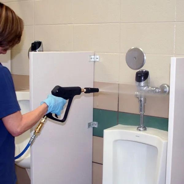 Restroom cleaning with aqueous ozone spray gun